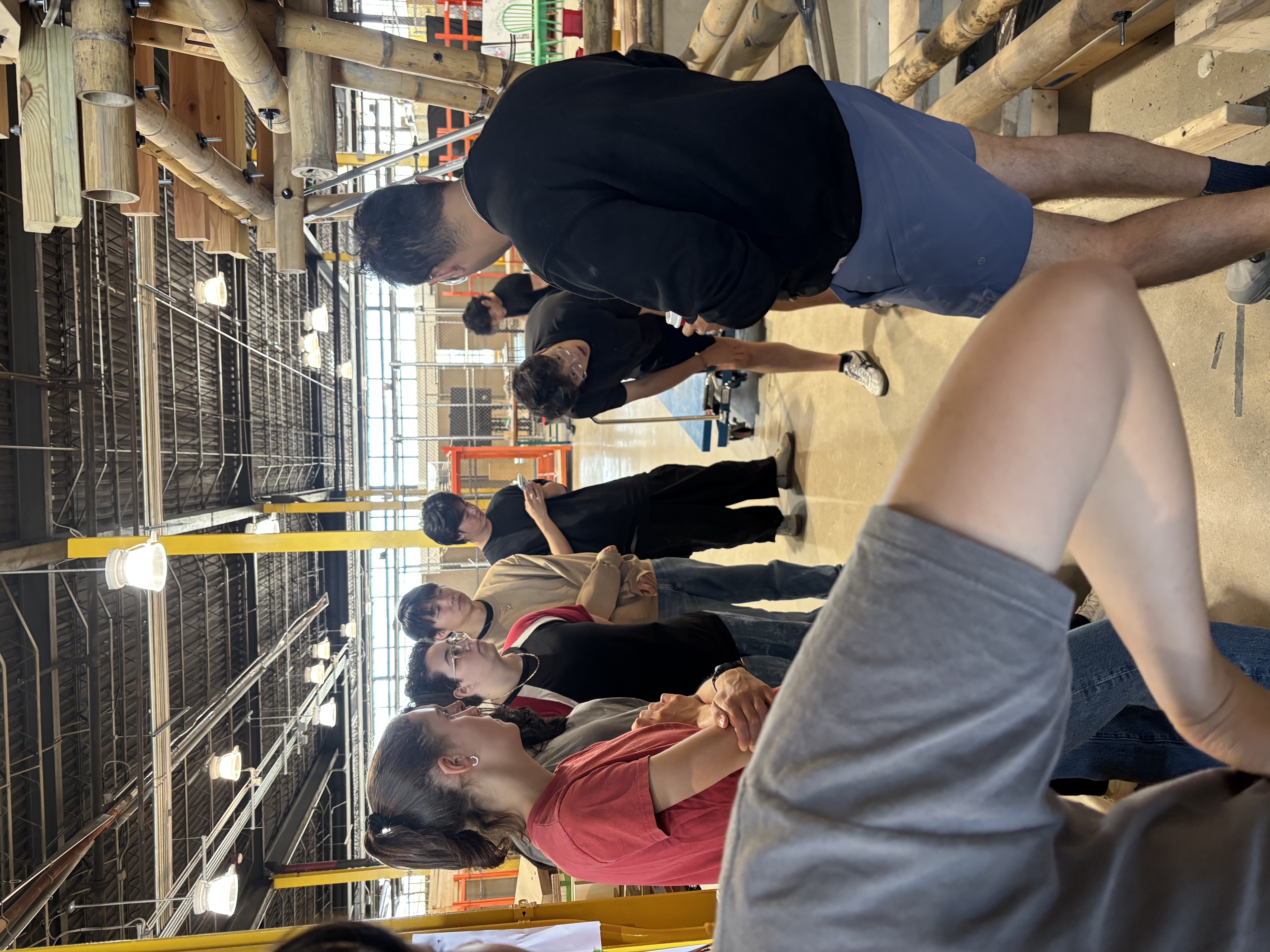 Teaching team gathered around the Sankofa Bamboo Greenhouse